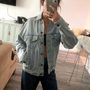 Understated leather light wash denim jacket